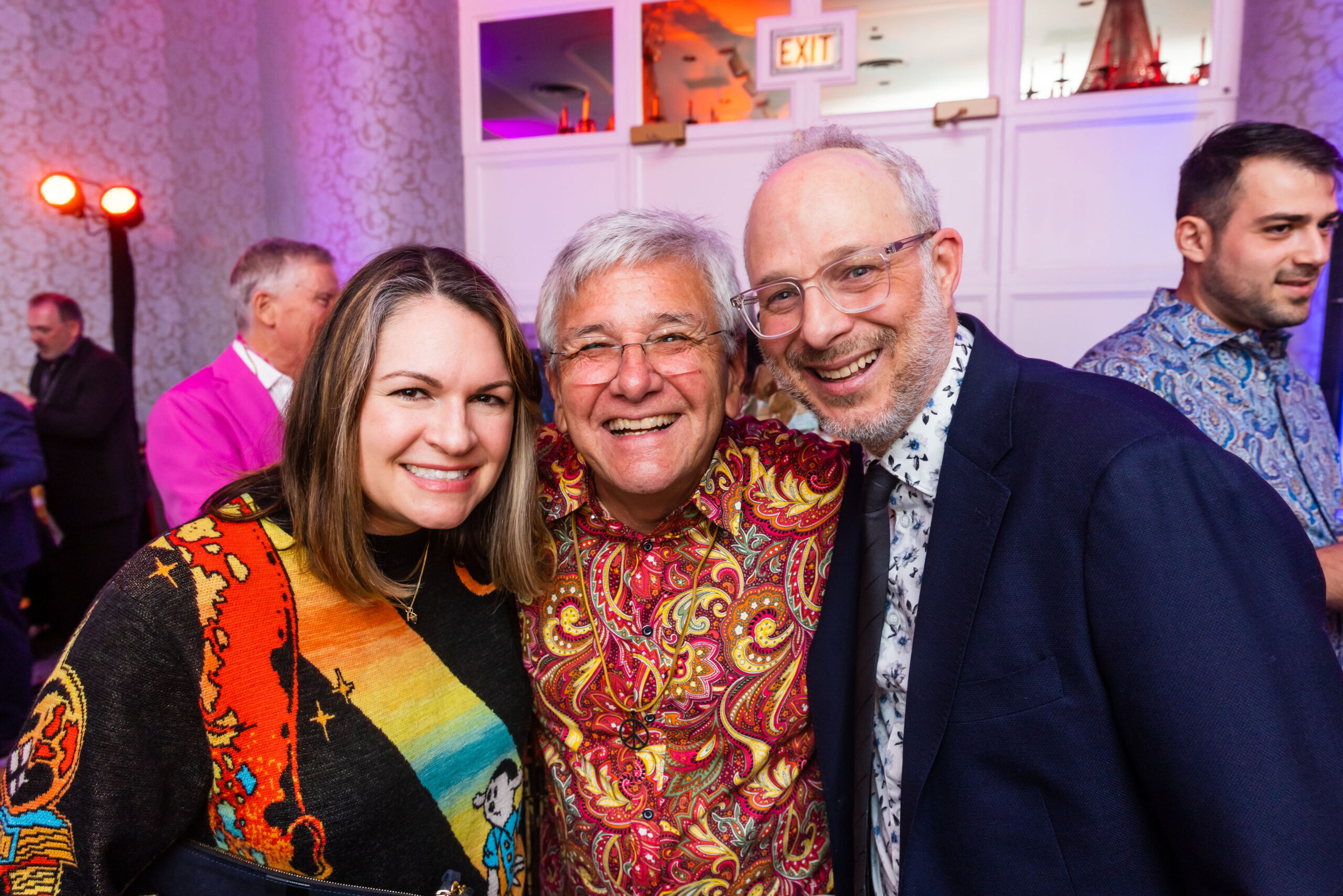 three people smiling