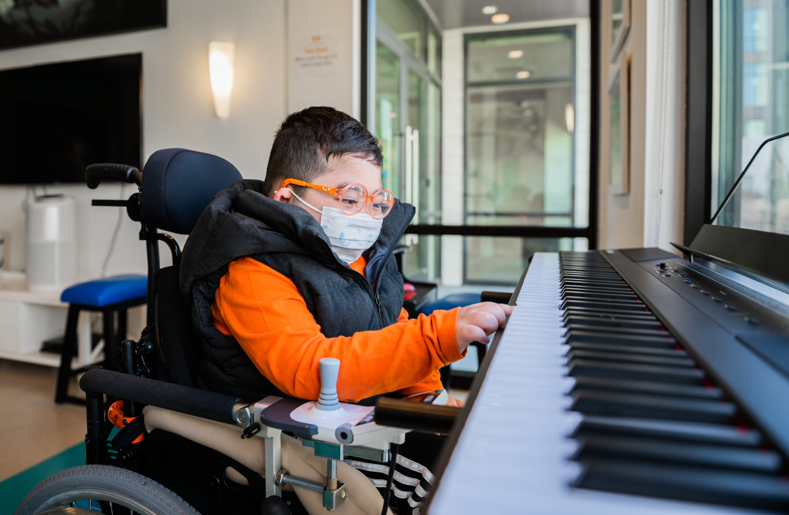 boy reaching for keyboard