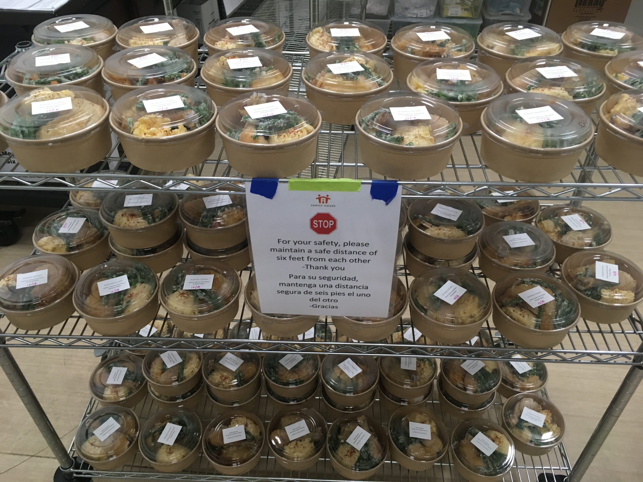 A triple decker cart full of individually wrapped meals Delivery December 2020 for Families staying at Family House San Francisco