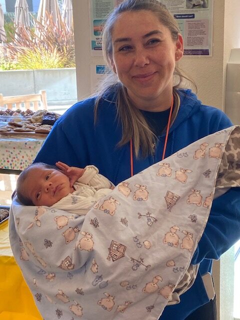 mom holding baby