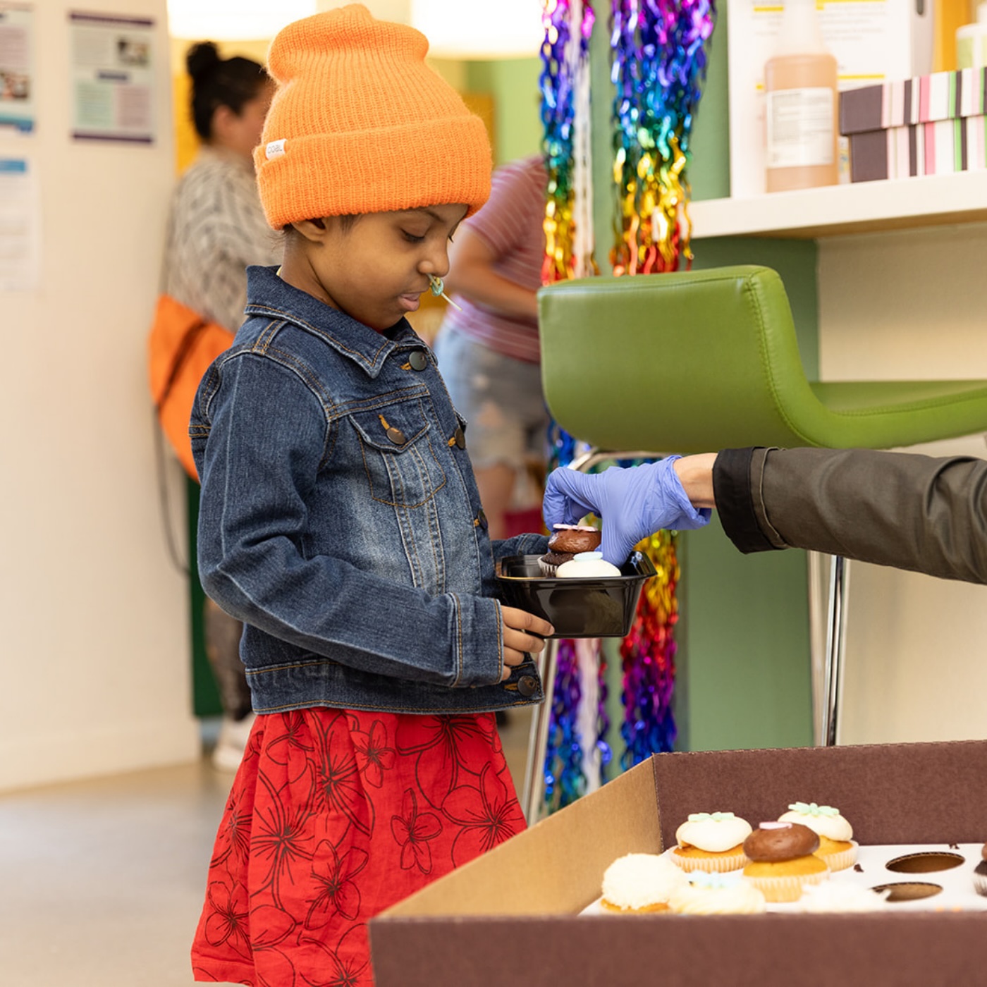 girl getting cupcake