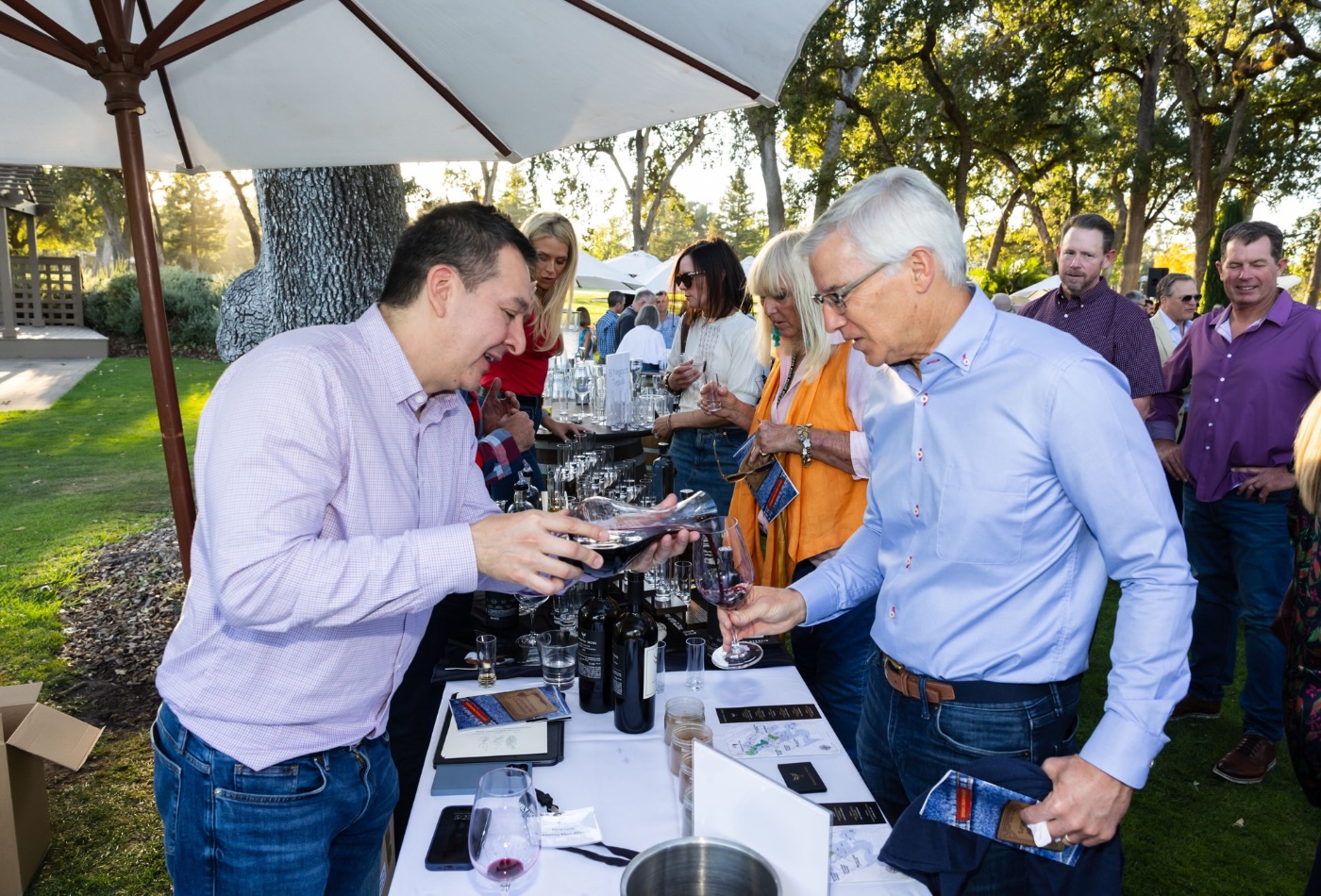 man pouring wine