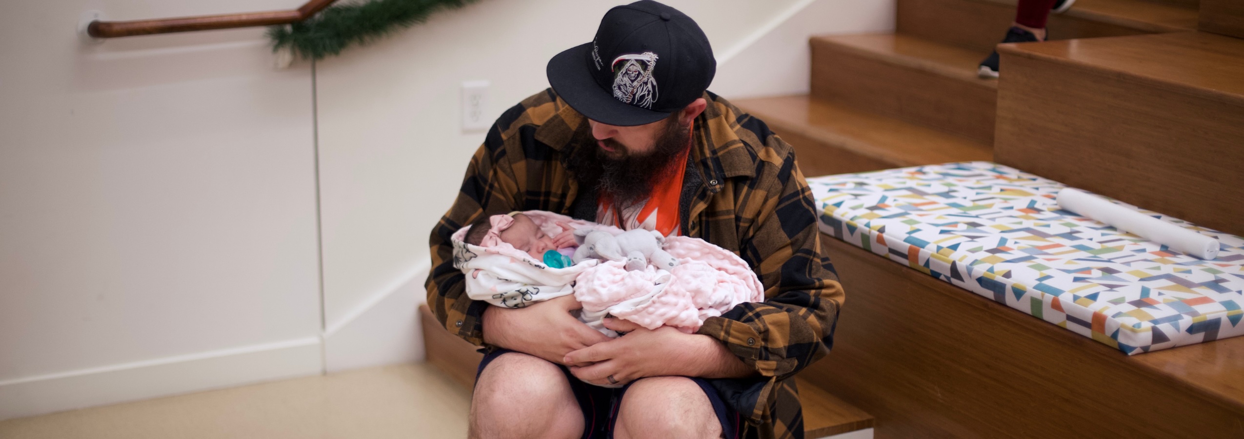dad holding baby