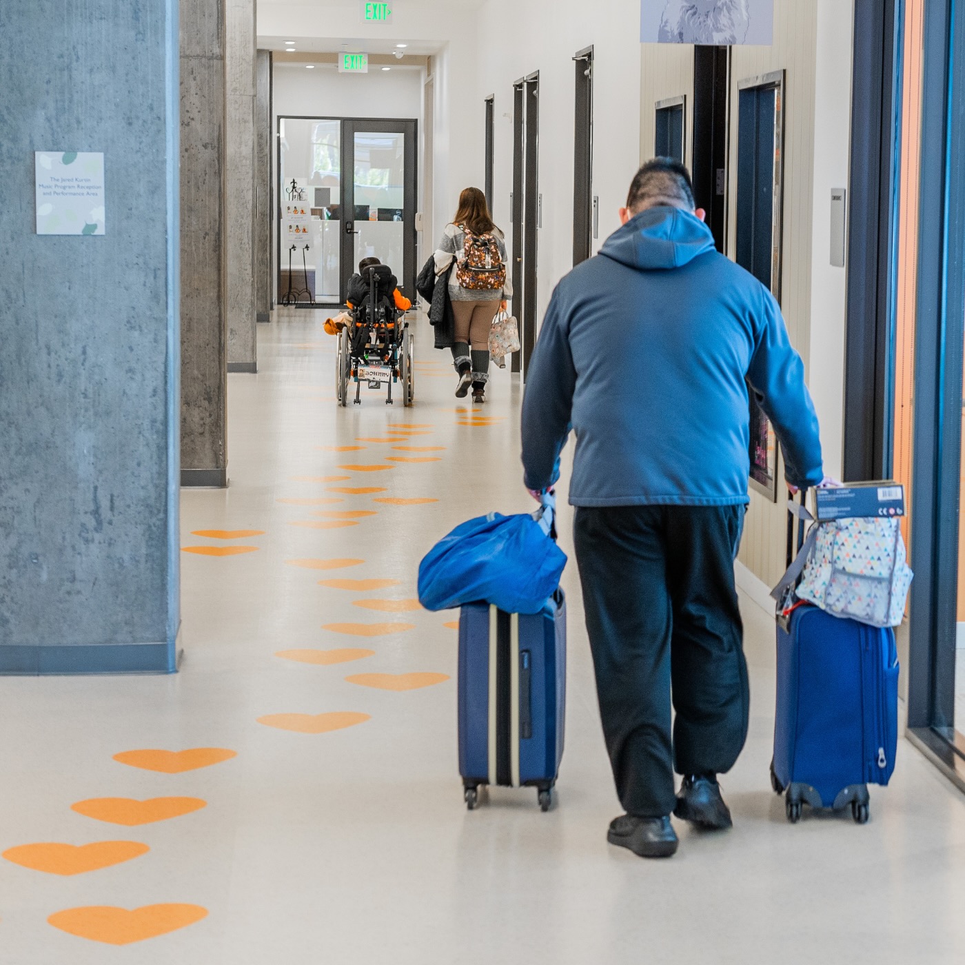 family walking down the hallway