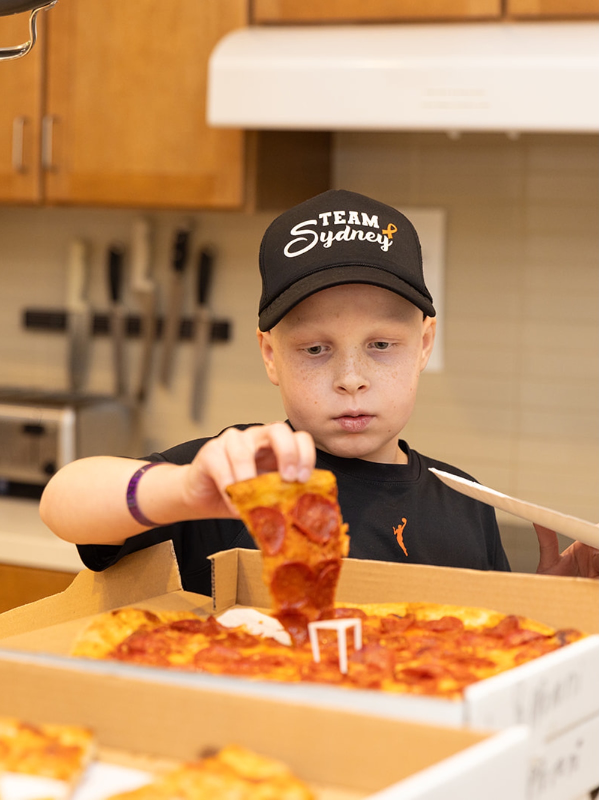 boy eating pizza