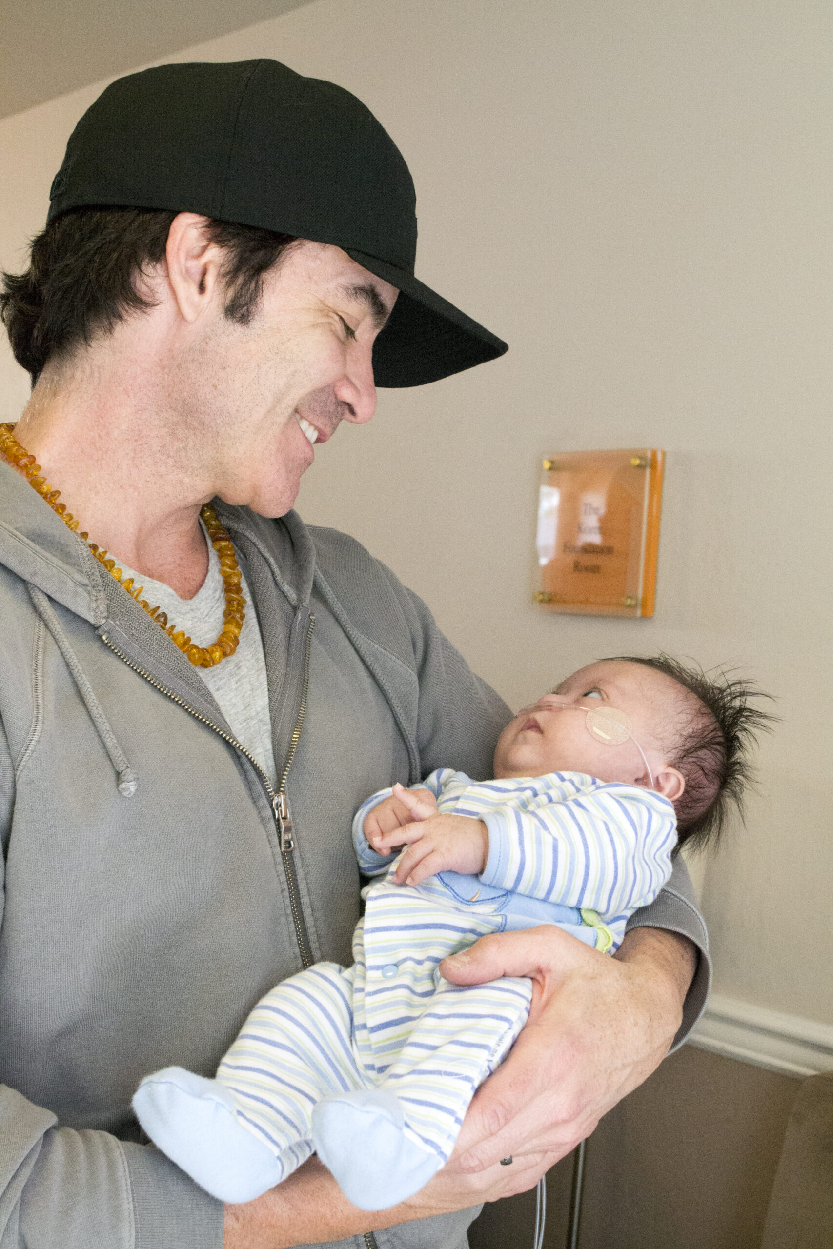 Pat Monahan holding a baby