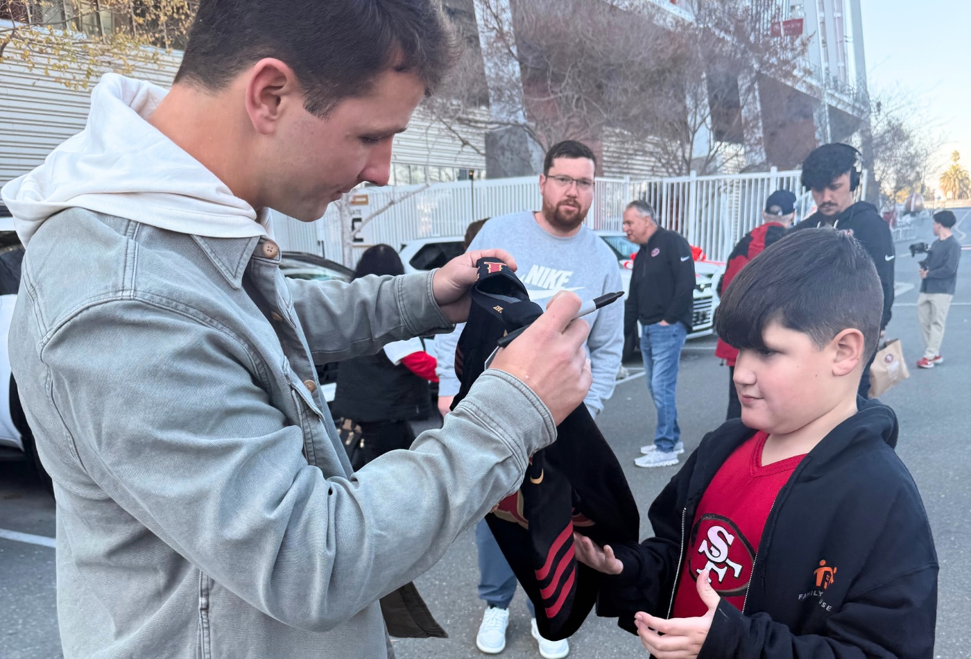 Brock signing jersey